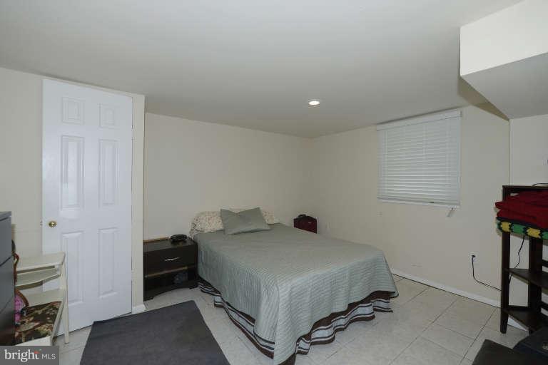 6023 Craig Street Springfield, VA 22150 - Photo 15 of 27 a bedroom with a bed and a window