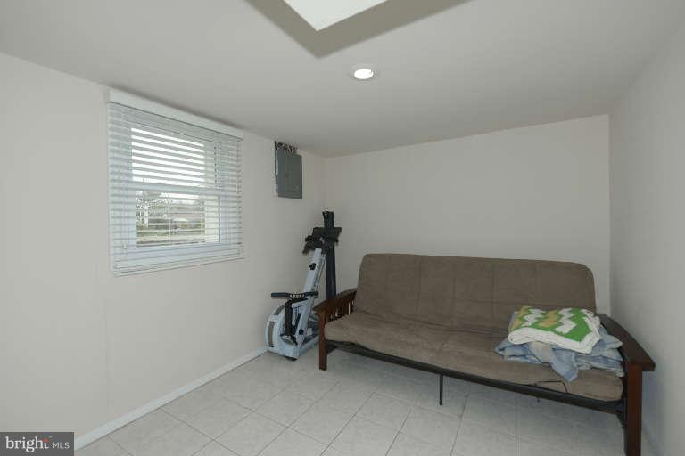 6023 Craig Street Springfield, VA 22150 - Photo 16 of 27 a living room with furniture and a window