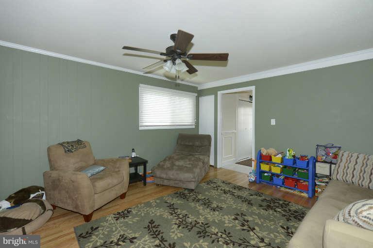 6023 Craig Street Springfield, VA 22150 - Photo 4 of 27 a living room with furniture chess table and a window
