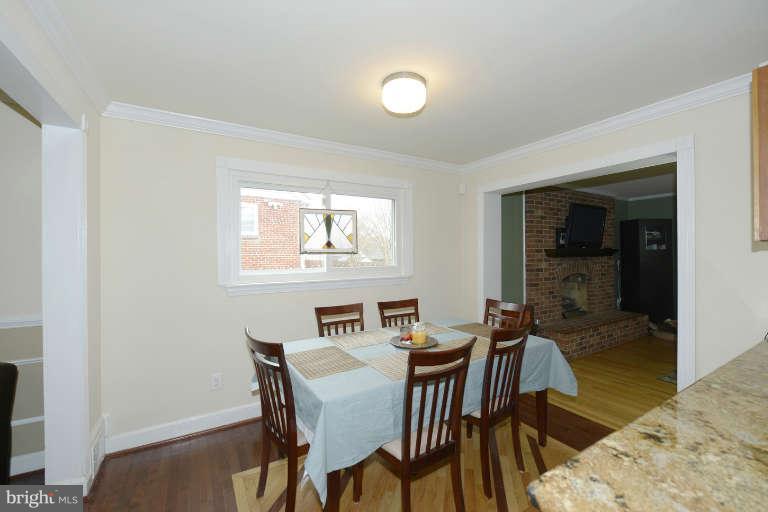 6023 Craig Street Springfield, VA 22150 - Photo 7 of 27 a view of a dining room with furniture and window