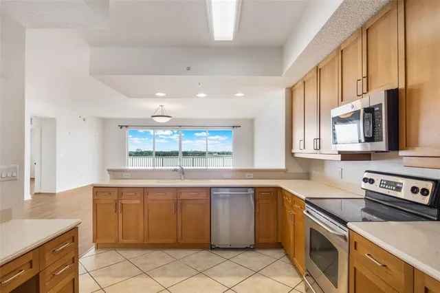 a kitchen with a refrigerator sink and stove