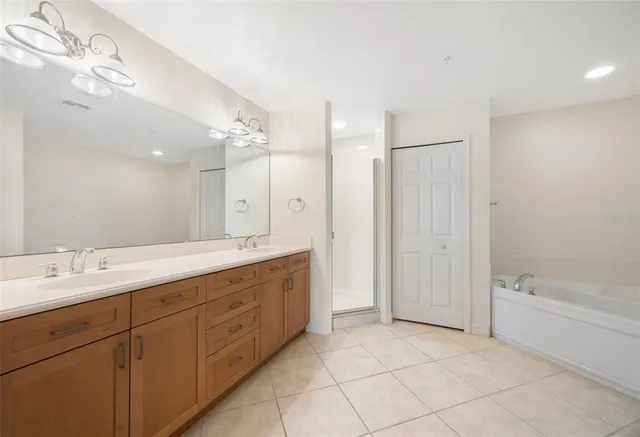 a bathroom with a bathtub and shower