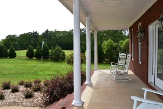3700 Johnstonville Road Forsyth, GA 31029 - Photo 22 of 24 a view of a patio with a table chairs and a backyard