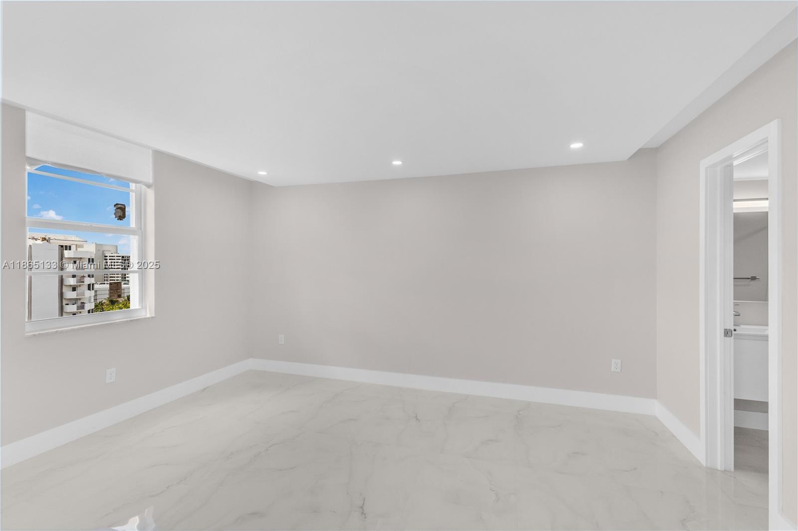 1331 Lincoln Road, Unit 1302 Miami Beach, FL 33139 - Photo 12 of 40 an empty room with a empty space and window