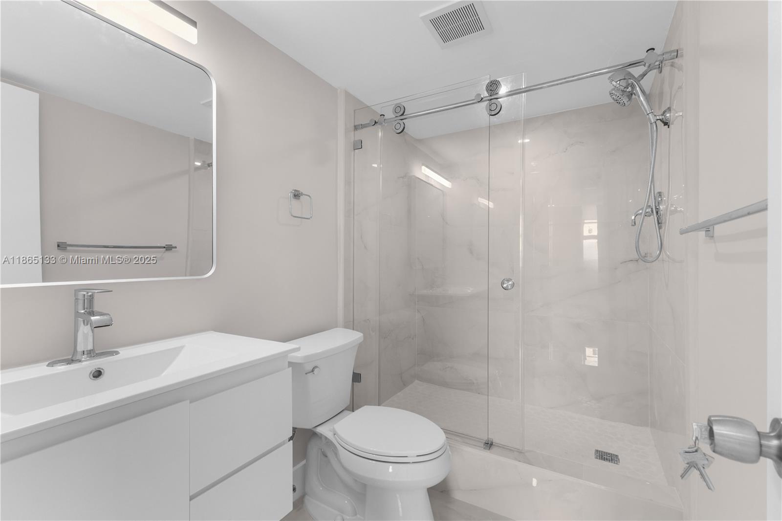 1331 Lincoln Road, Unit 1302 Miami Beach, FL 33139 - Photo 13 of 40 a bathroom with a sink toilet and shower