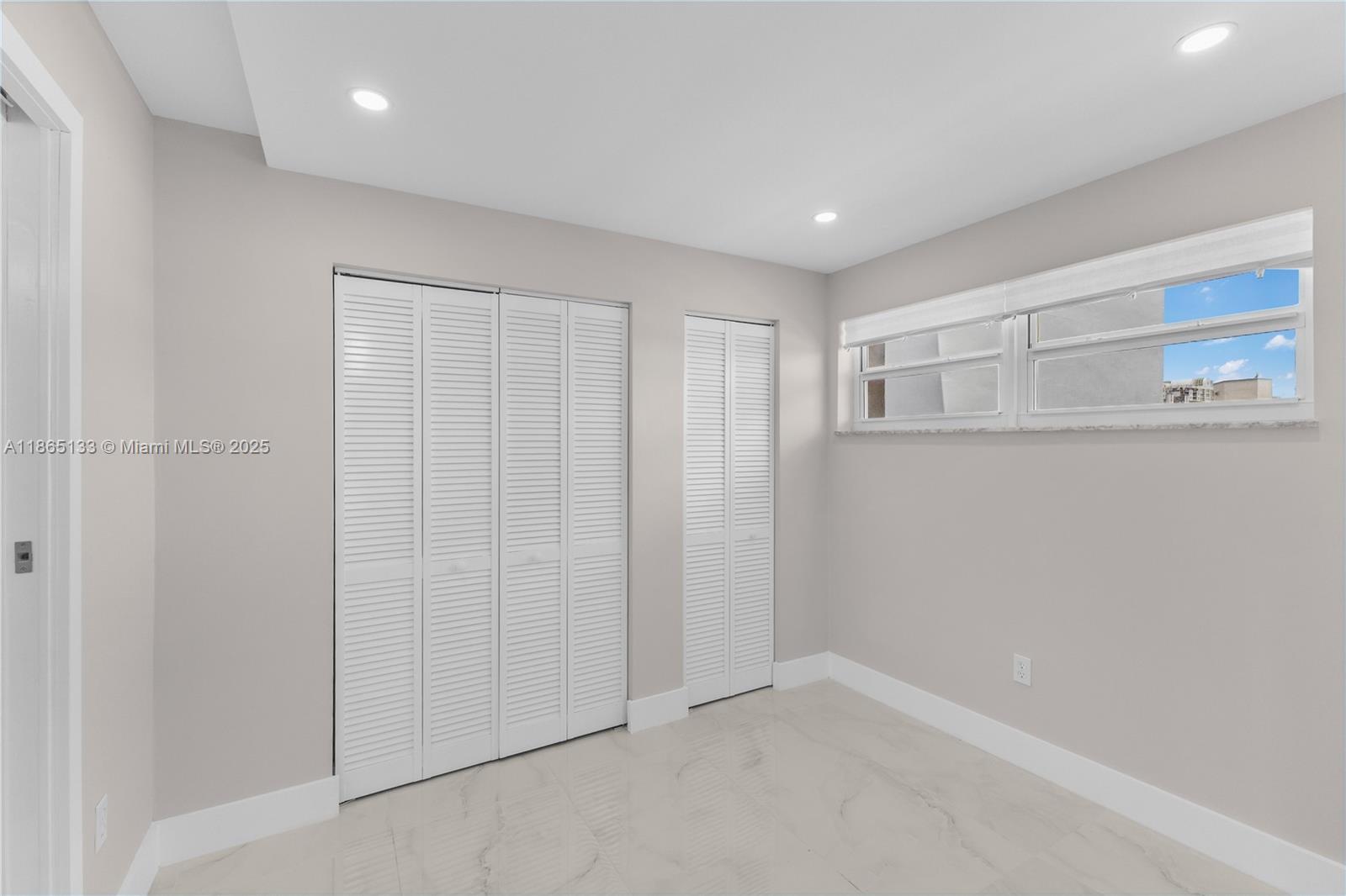 1331 Lincoln Road, Unit 1302 Miami Beach, FL 33139 - Photo 17 of 40 a bathroom with a shower and a glass door