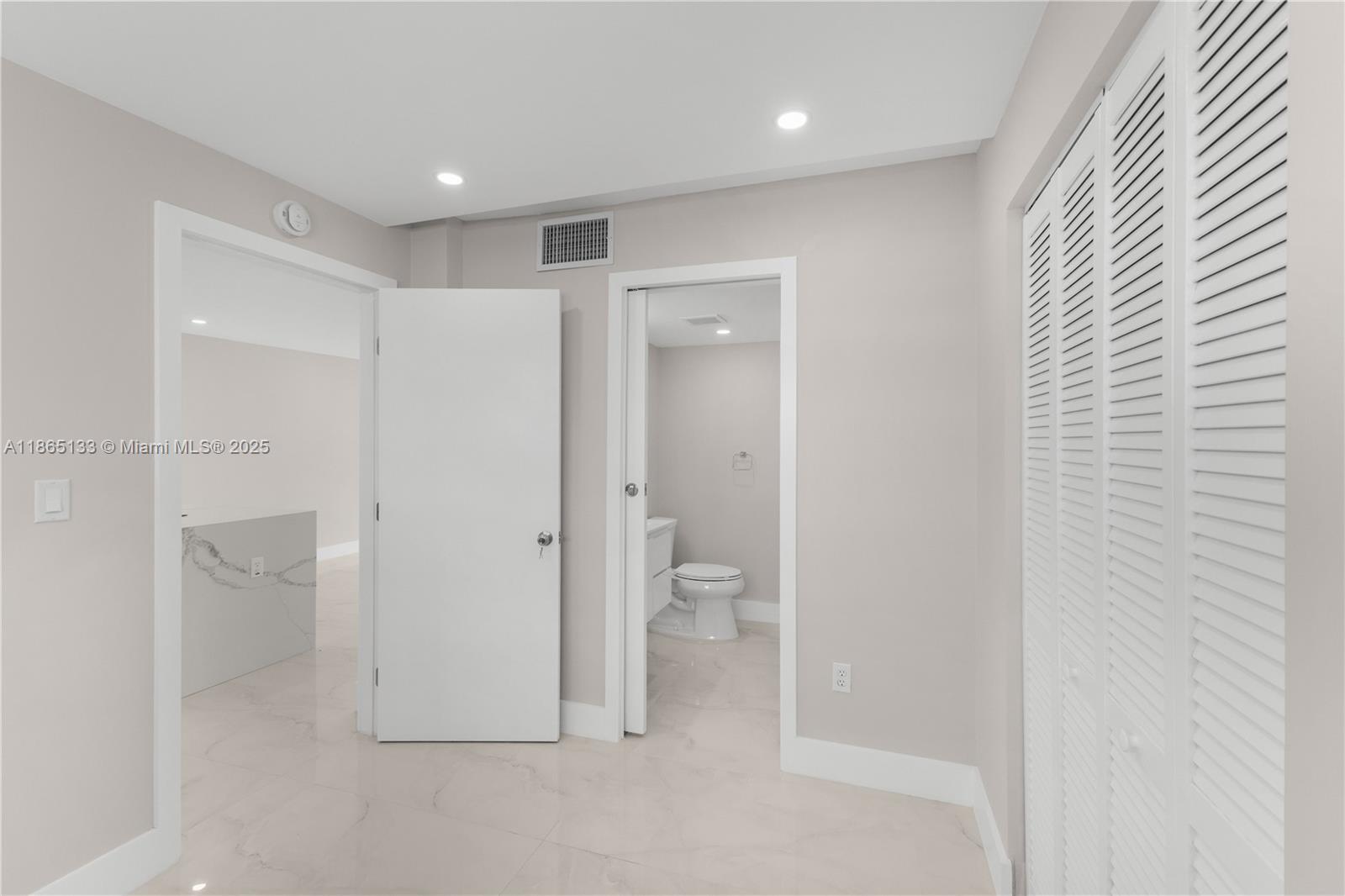 1331 Lincoln Road, Unit 1302 Miami Beach, FL 33139 - Photo 18 of 40 a bathroom with a shower and a toilet