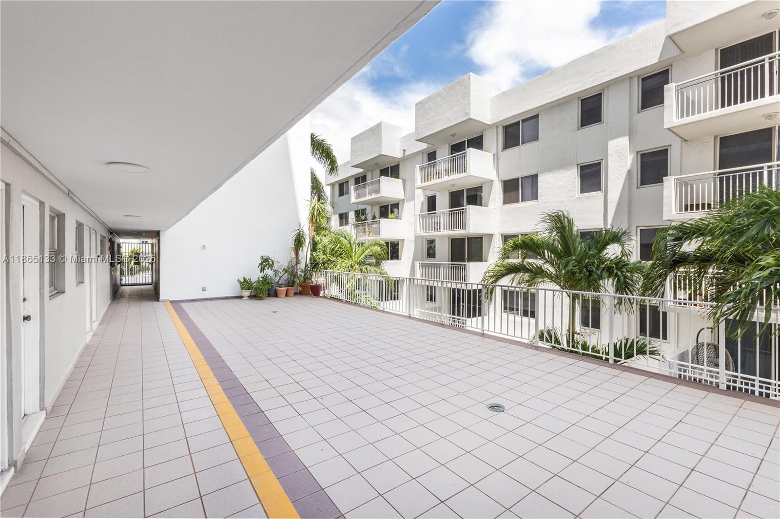 1331 Lincoln Road, Unit 1302 Miami Beach, FL 33139 - Photo 32 of 40 a view of a building with the street