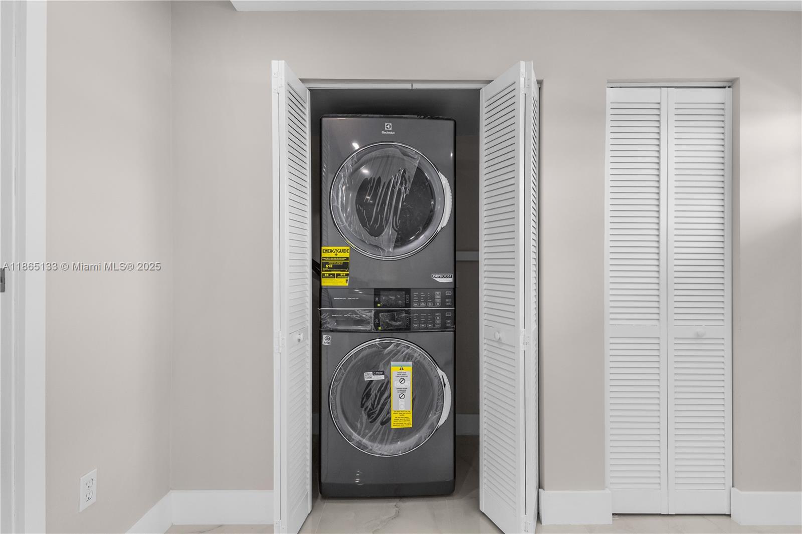 1331 Lincoln Road, Unit 1302 Miami Beach, FL 33139 - Photo 39 of 40 a view of an entryway with washer and dryer