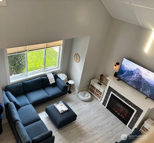 a living room with furniture and a window