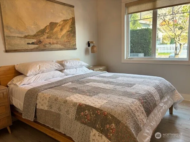 a bedroom with a bed and window