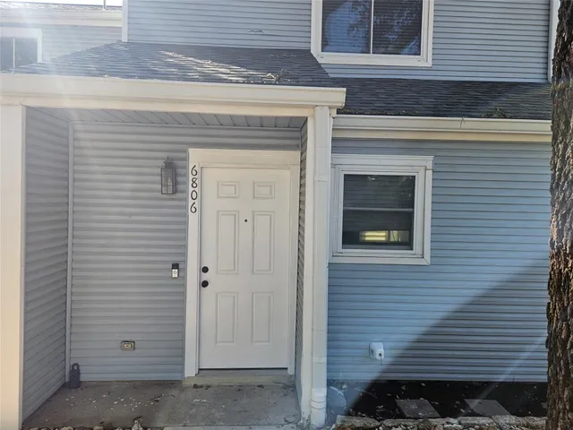 a view of front door and a window