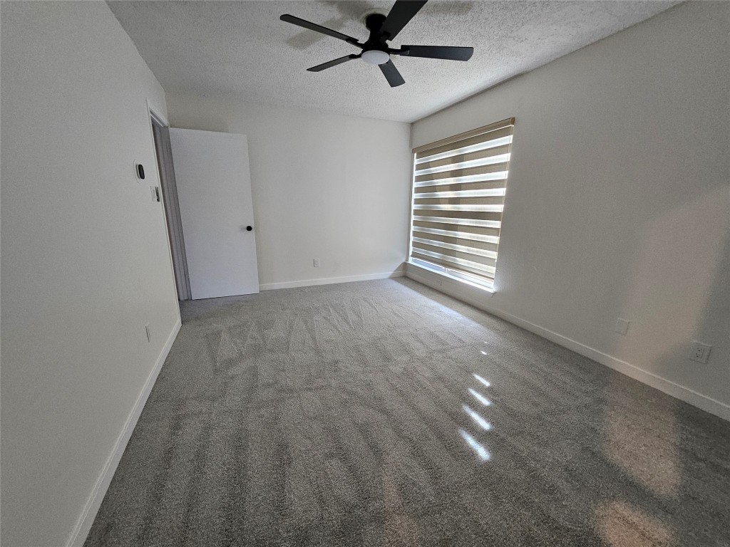 6806 Old Quarry Lane Austin, TX 78731 - Photo 24 of 29 wooden floor in an empty room with a window