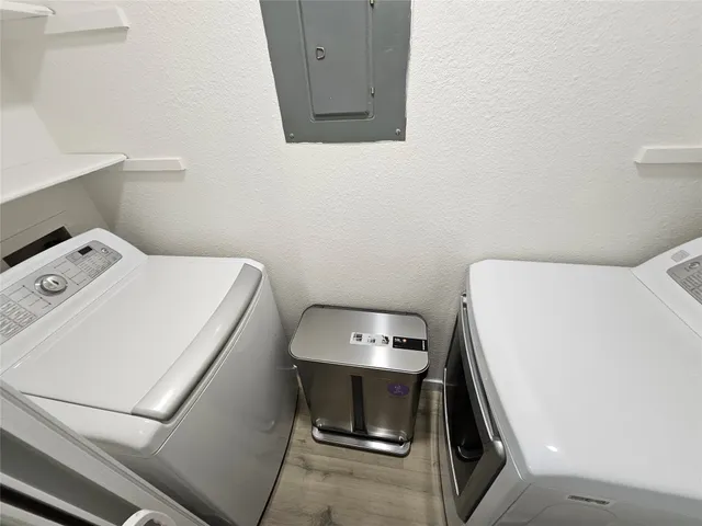 a view of a stove top oven sitting inside of a kitchen