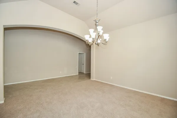 a view of a chandelier fan and a chandelier fan in a room