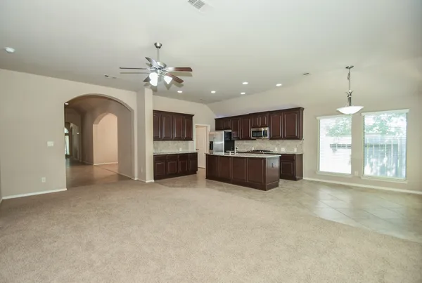 a view of a kitchen with a sink and a kitchen view