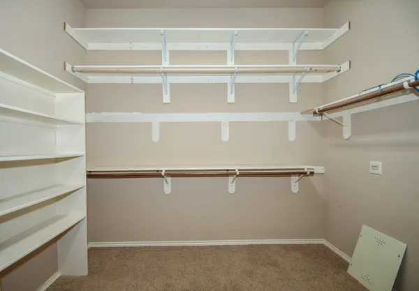 a view of an empty walk in closet