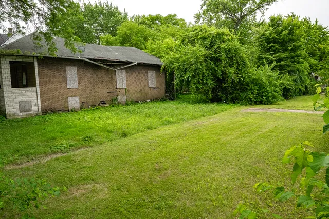 a backyard of a house with lots of green space