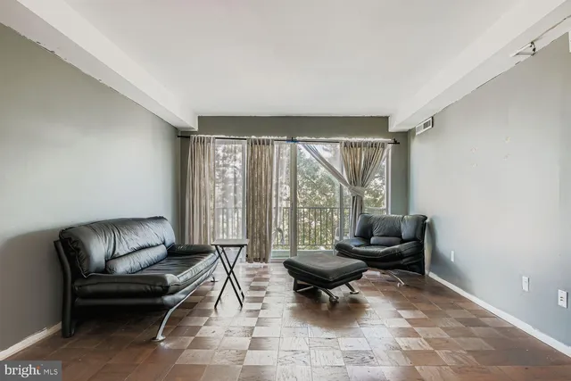 a living room with furniture and a rug