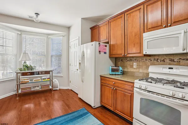 a kitchen with a table and chairs in it