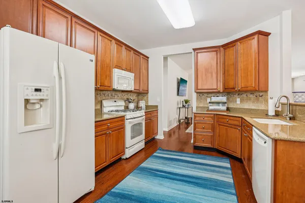 a bedroom with bed and a chandelier