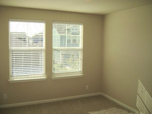 8513 Inca Dove Drive, Unit 363 Austin, TX 78729 - Photo 13 of 15 a view of a room that has a window in it