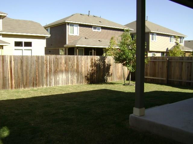 8513 Inca Dove Drive, Unit 363 Austin, TX 78729 - Photo 15 of 15 a front view of a house with garden