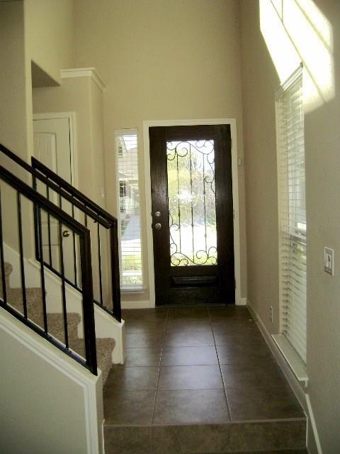 8513 Inca Dove Drive, Unit 363 Austin, TX 78729 - Photo 2 of 15 a view of entryway with stairs
