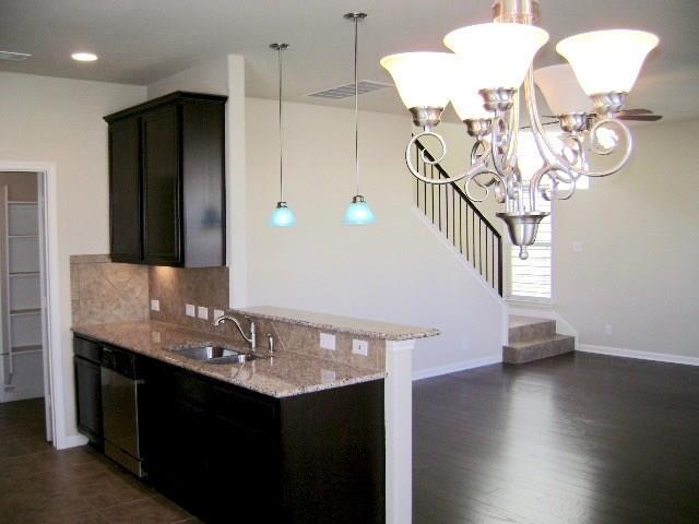 8513 Inca Dove Drive, Unit 363 Austin, TX 78729 - Photo 7 of 15 a view of entryway and kitchen with wooden floor