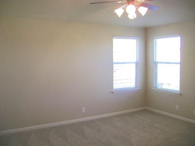 8513 Inca Dove Drive, Unit 363 Austin, TX 78729 - Photo 10 of 15 an empty room with a window