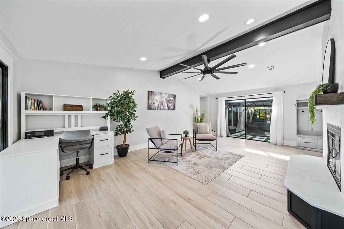 470 Rio Vista Lane Merritt Island, FL 32952 - Photo 21 of 54 a living room with furniture and a wooden floor