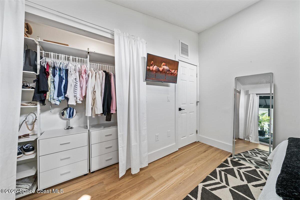 470 Rio Vista Lane Merritt Island, FL 32952 - Photo 28 of 54 a view of a bedroom with wooden floor