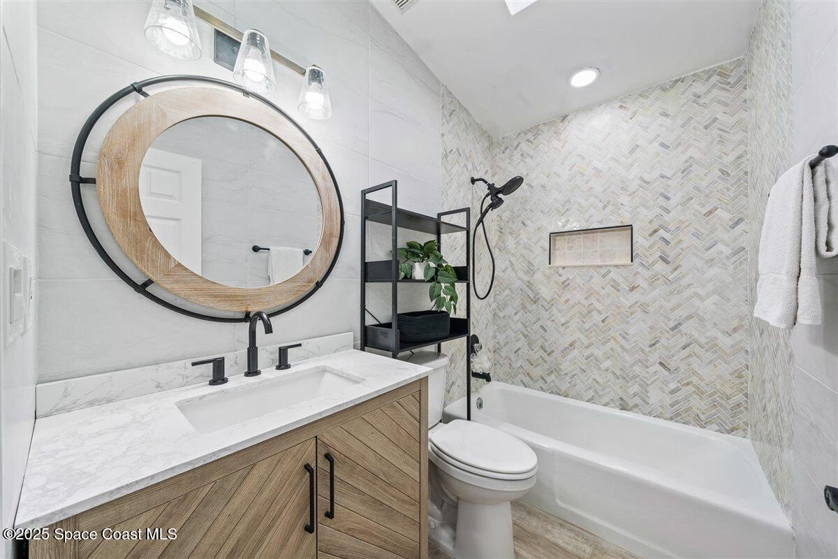 470 Rio Vista Lane Merritt Island, FL 32952 - Photo 31 of 54 a bathroom with a sink and a mirror