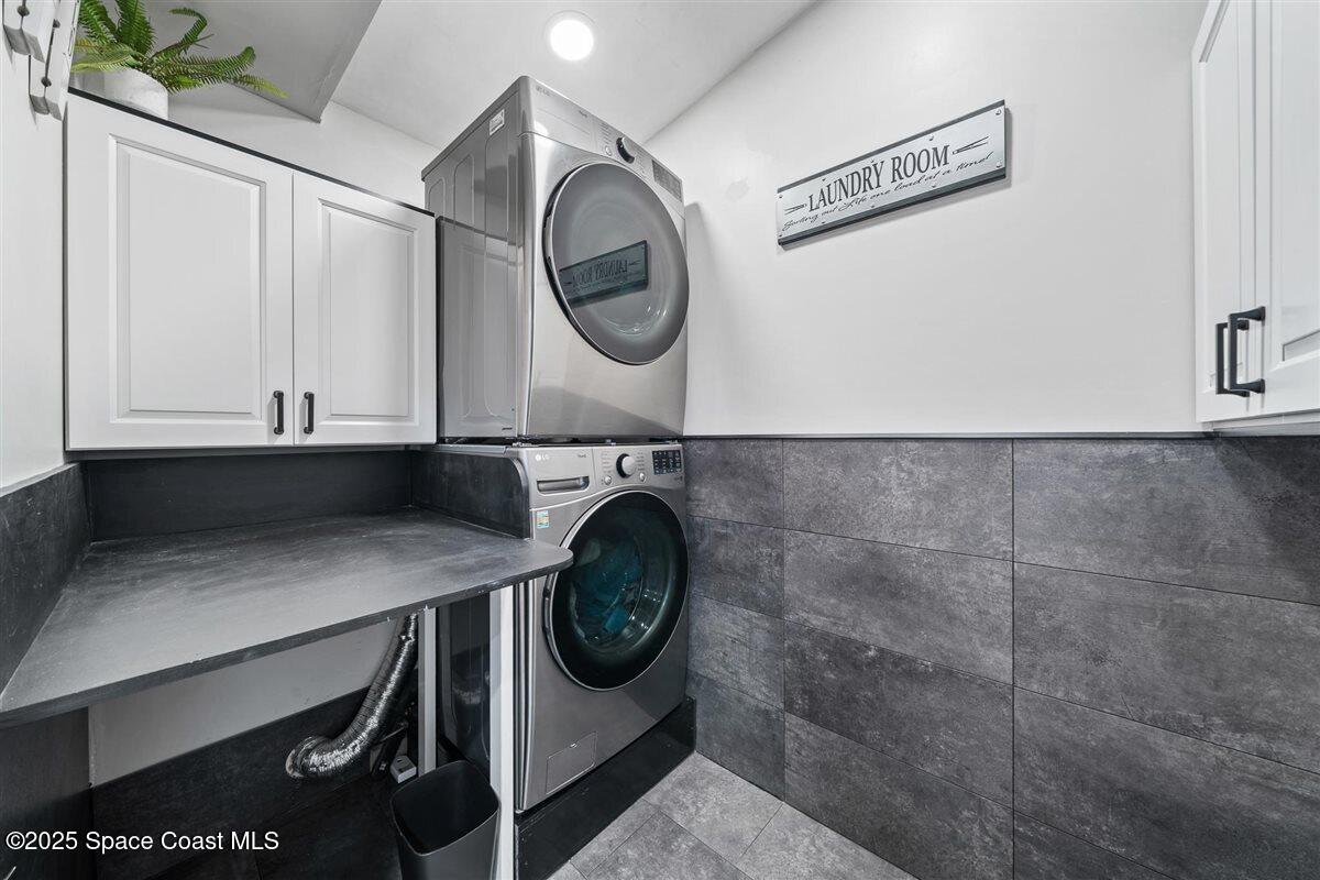 470 Rio Vista Lane Merritt Island, FL 32952 - Photo 32 of 54 a utility room with dryer and washer