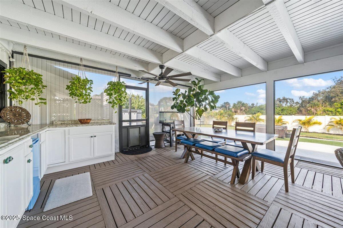 470 Rio Vista Lane Merritt Island, FL 32952 - Photo 33 of 54 a outdoor space with lots of furniture and a potted plant