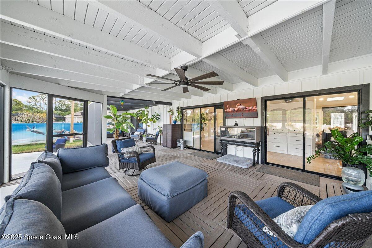 470 Rio Vista Lane Merritt Island, FL 32952 - Photo 34 of 54 a living room with furniture and a large window