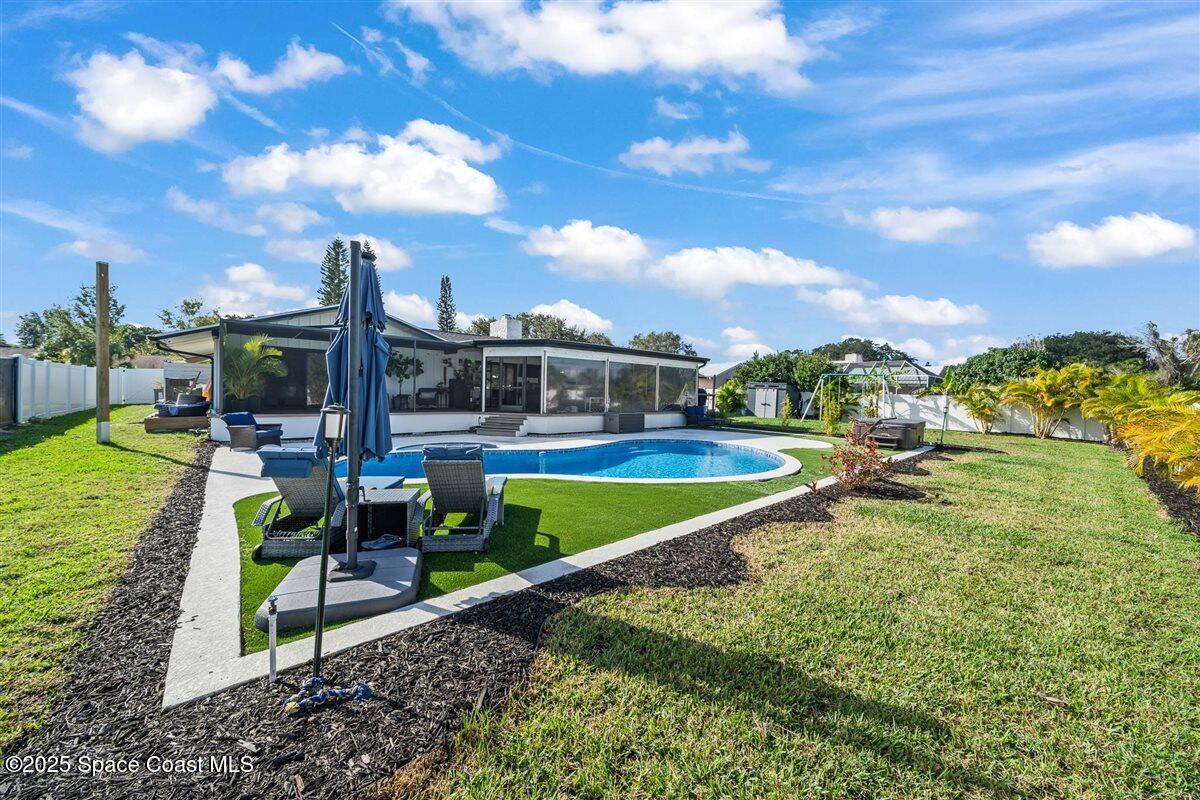 470 Rio Vista Lane Merritt Island, FL 32952 - Photo 39 of 54 a view of a swimming pool with a patio