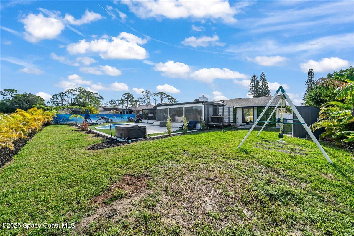 470 Rio Vista Lane Merritt Island, FL 32952 - Photo 43 of 54 a view of a house with a swimming pool