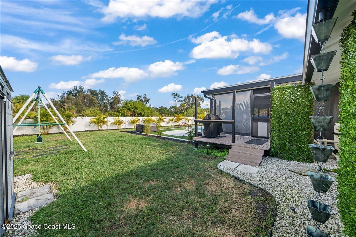 470 Rio Vista Lane Merritt Island, FL 32952 - Photo 44 of 54 a view of a garden with a slide