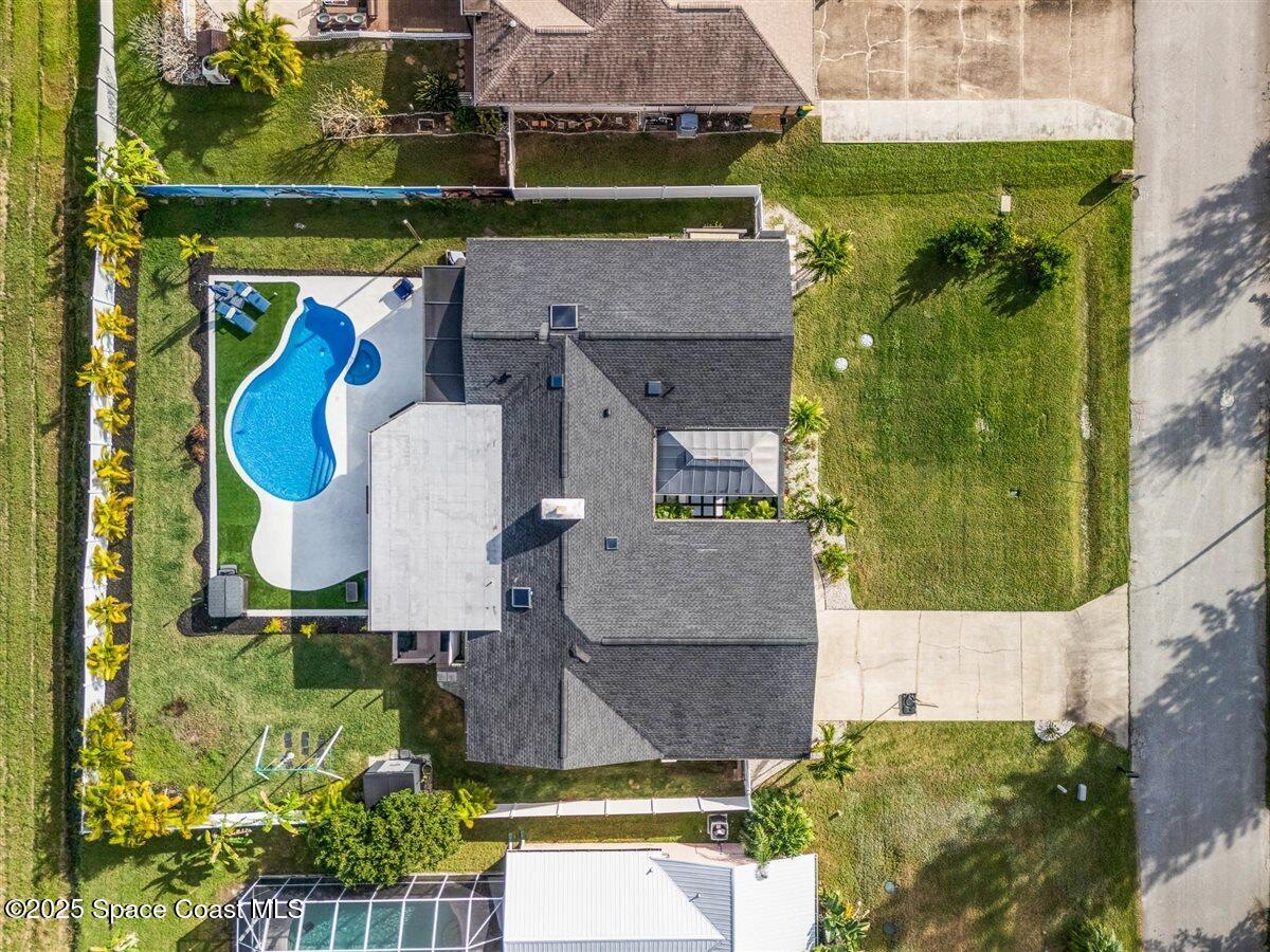 470 Rio Vista Lane Merritt Island, FL 32952 - Photo 52 of 54 an aerial view of a house with a swimming pool