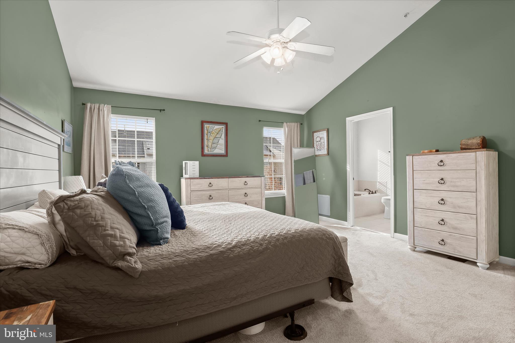 1055 Lily Way Odenton, MD 21113 - Photo 16 of 56 a bedroom with a bed and a chandelier