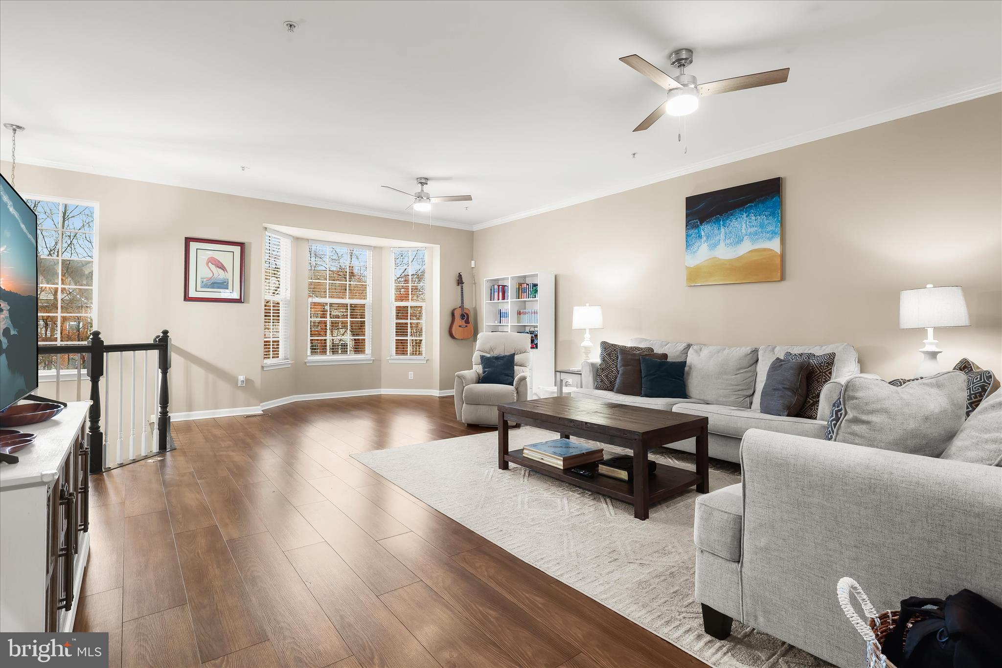 1055 Lily Way Odenton, MD 21113 - Photo 2 of 56 a living room with furniture and a wooden floor