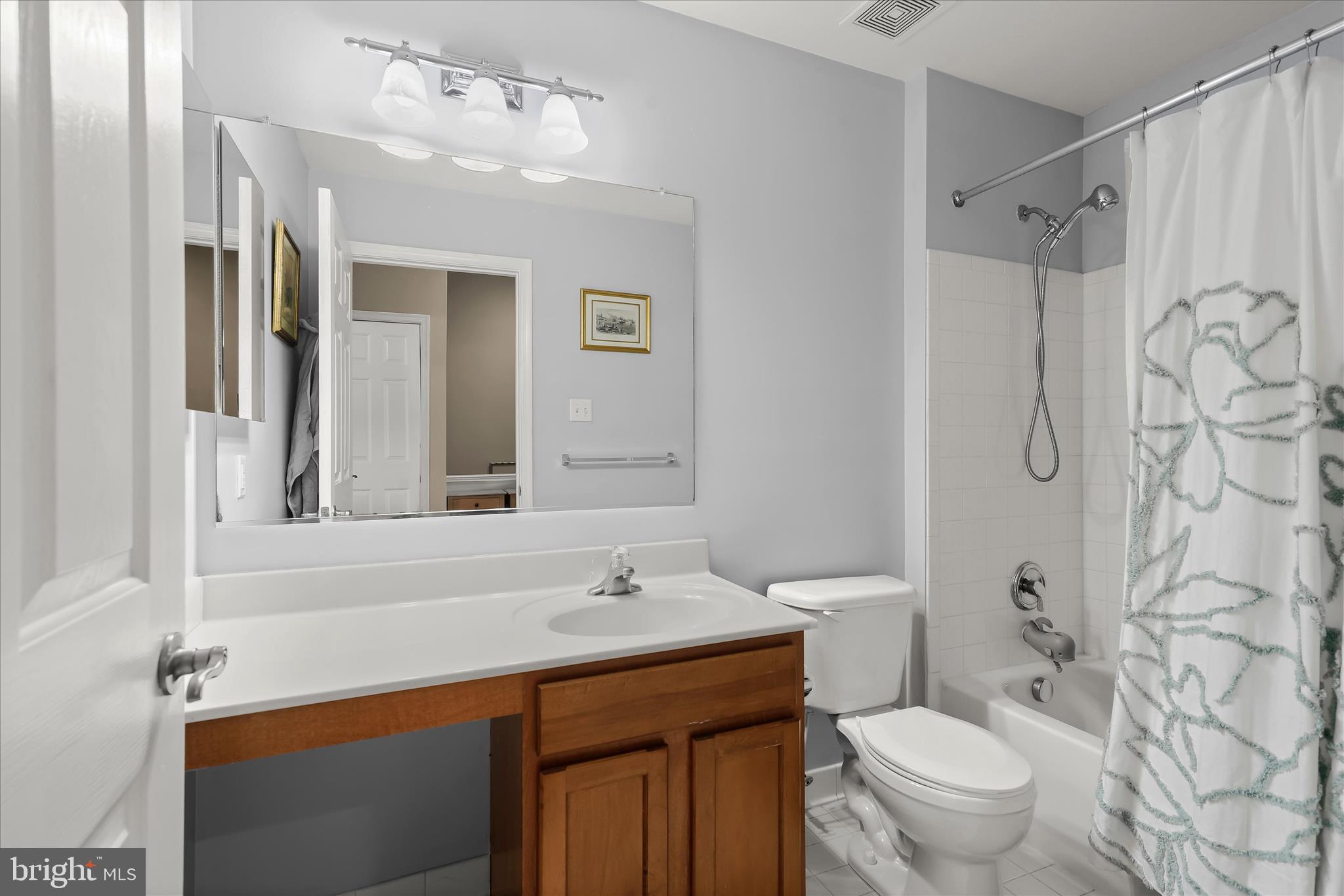 1055 Lily Way Odenton, MD 21113 - Photo 23 of 56 a bathroom with a sink toilet double vanity and shower