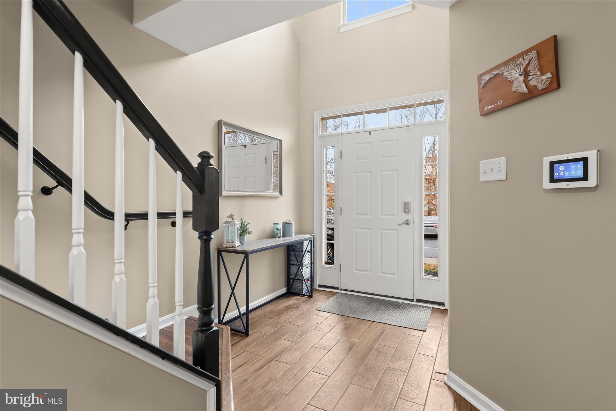 1055 Lily Way Odenton, MD 21113 - Photo 25 of 56 a view of entryway with wooden floor and stairs