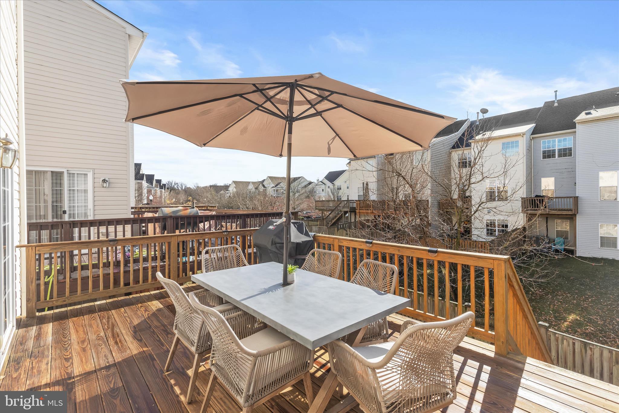 1055 Lily Way Odenton, MD 21113 - Photo 32 of 56 a view of a balcony with furniture and umbrella