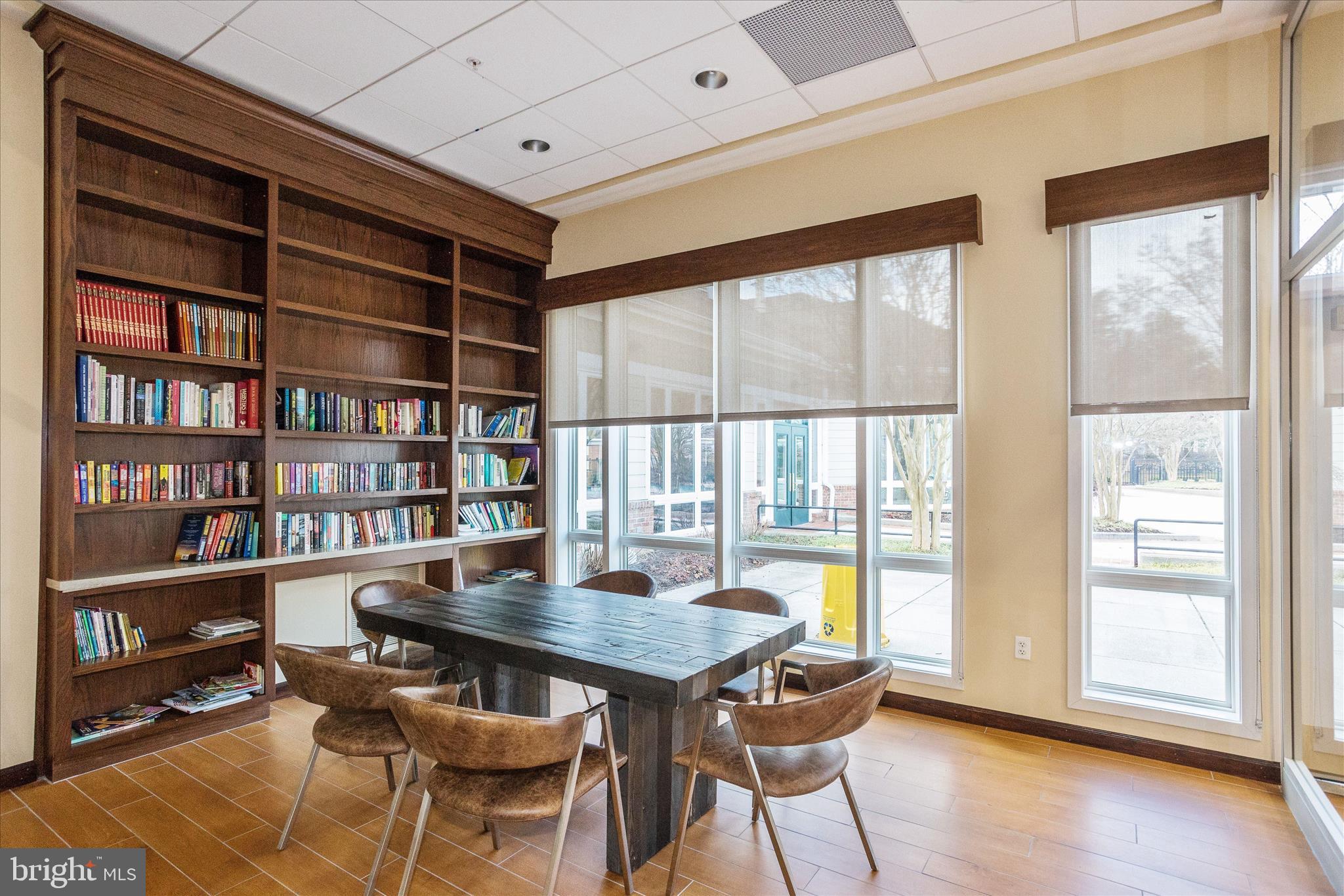 1055 Lily Way Odenton, MD 21113 - Photo 43 of 56 a view of a workspace with furniture and a bookshelf