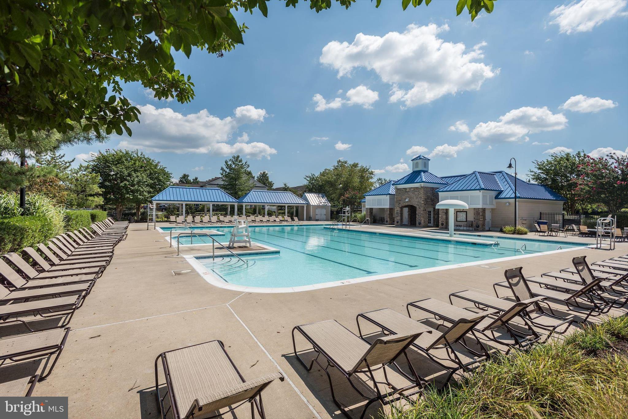 1055 Lily Way Odenton, MD 21113 - Photo 52 of 56 a view of a swimming pool with a patio and a yard
