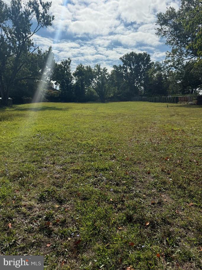 910 Township Line Road Phoenixville, PA 19460 - Photo 1 of 2 a view of a large pool with lawn chairs under an umbrella