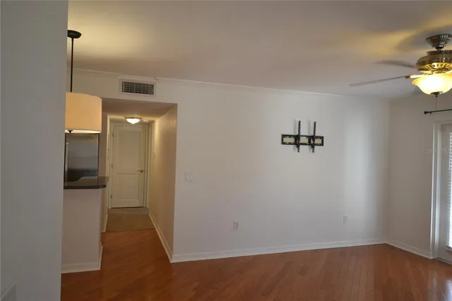 a kitchen with a refrigerator and a sink
