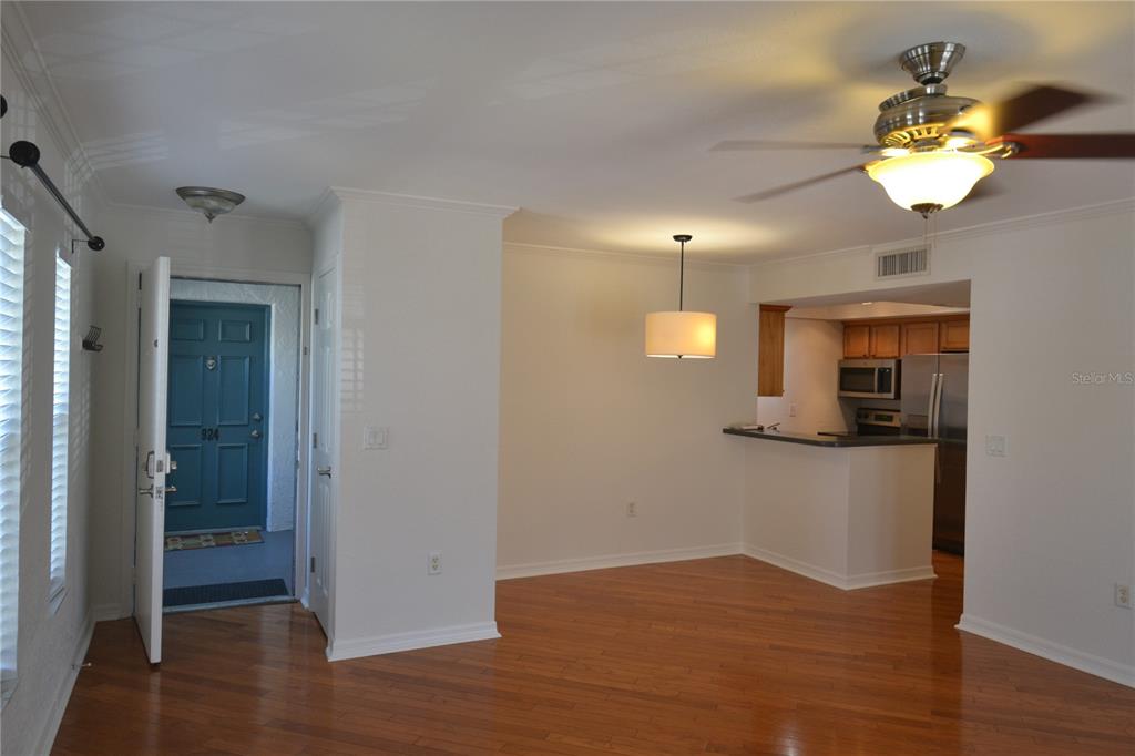 718 Lyndhurst Street, Unit 922 Dunedin, FL 34698 - Photo 17 of 39 a view of a kitchen from the hallway